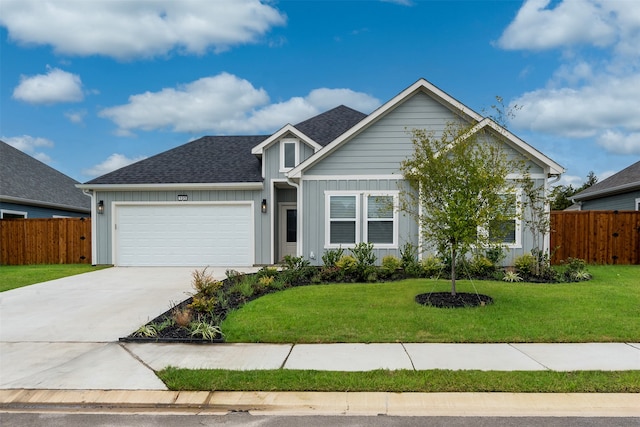 view of front facade with a garage and a front yard