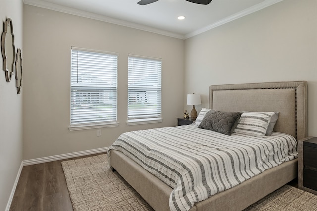 bedroom with ornamental molding, ceiling fan, and hardwood / wood-style floors