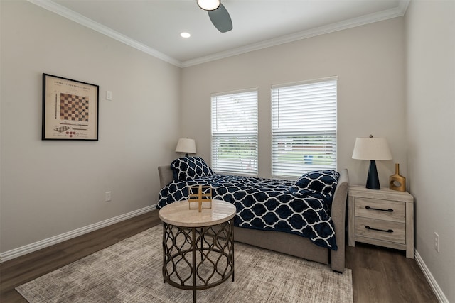 bedroom with dark hardwood / wood-style floors, ceiling fan, and ornamental molding