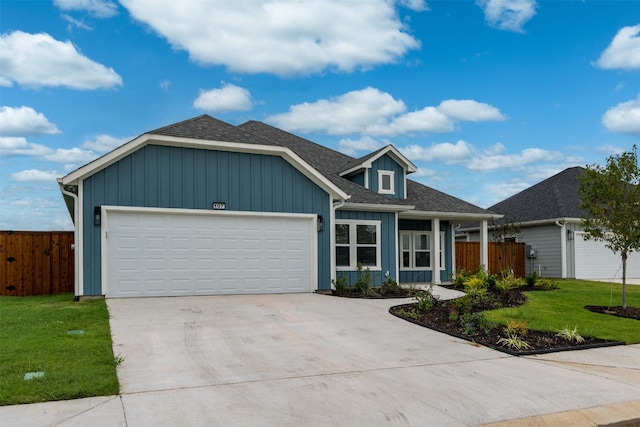 view of front of home featuring a garage and a front yard