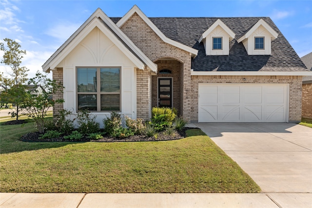 view of front facade with a front yard and a garage