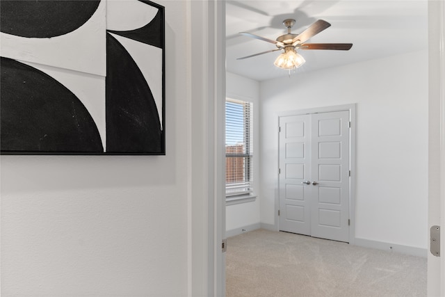 interior space featuring light colored carpet