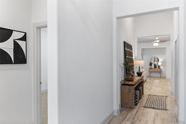 corridor featuring light hardwood / wood-style floors