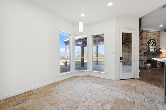 unfurnished dining area with crown molding