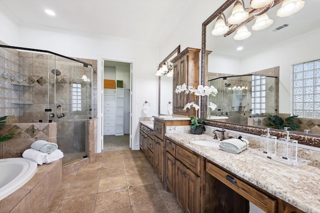 bathroom with plus walk in shower, crown molding, and vanity