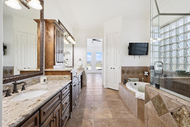 bathroom featuring crown molding, vanity, ceiling fan, and plus walk in shower