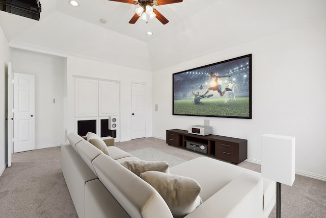 cinema featuring light carpet, vaulted ceiling, and ceiling fan