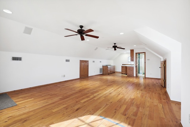 bonus room with light hardwood / wood-style flooring, ceiling fan, and vaulted ceiling