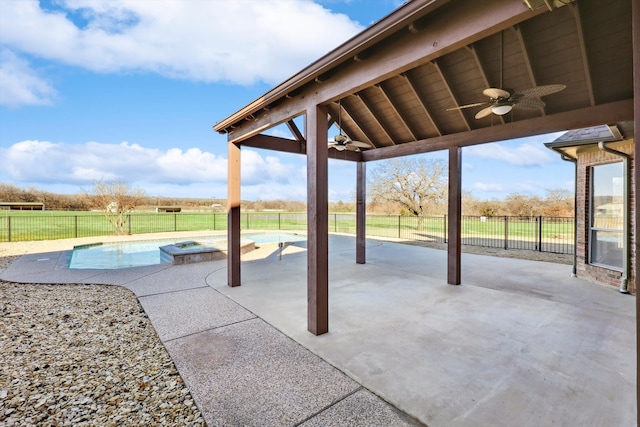 view of patio with ceiling fan, a fenced in pool, and a gazebo