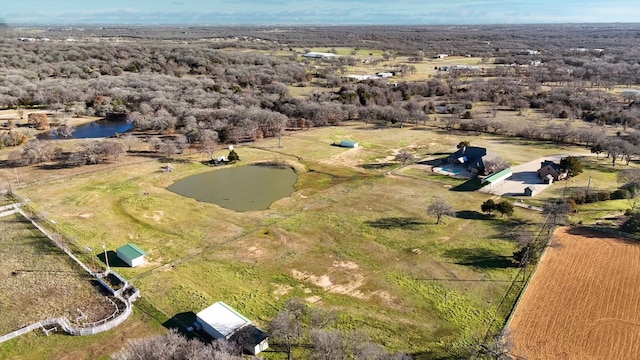 drone / aerial view featuring a rural view and a water view