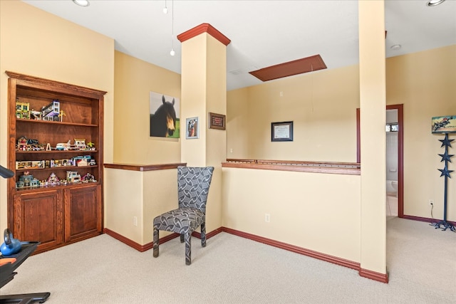 living area featuring light colored carpet