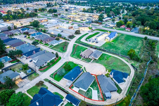 birds eye view of property with a residential view