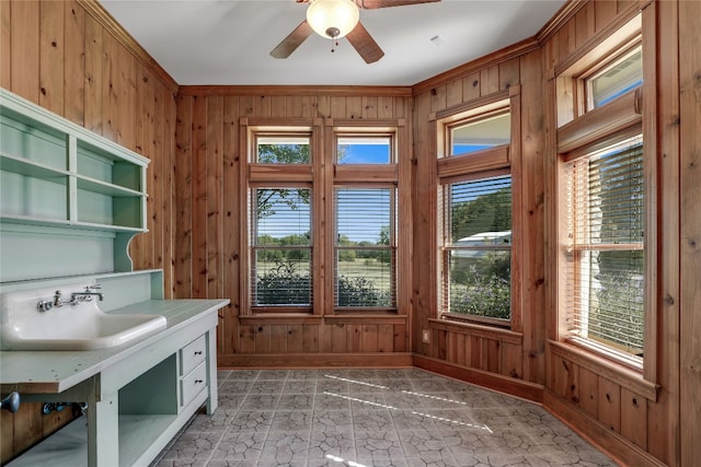 interior space with ceiling fan and sink