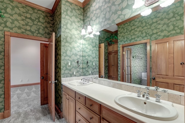 bathroom with dual bowl vanity and ornamental molding