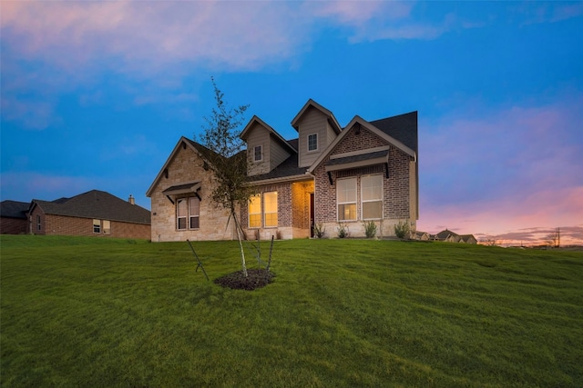 view of front of property with a lawn