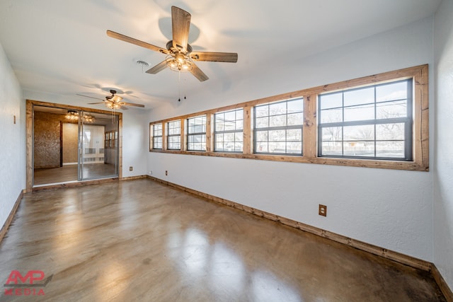 unfurnished room featuring concrete flooring