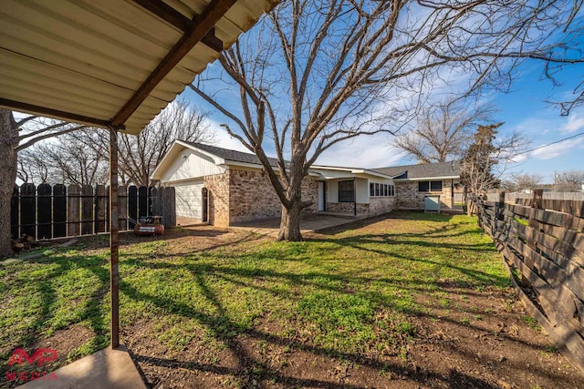 view of yard featuring a garage