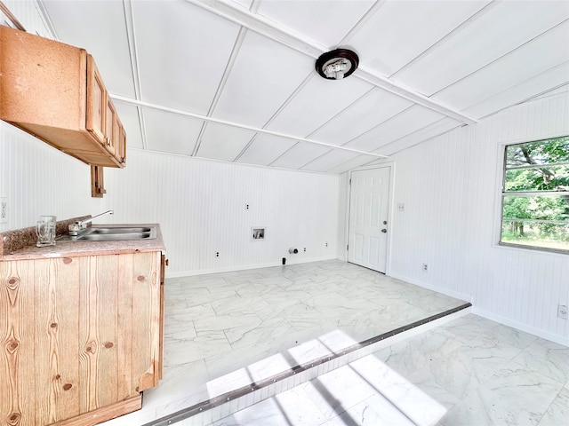 kitchen with sink and light tile flooring