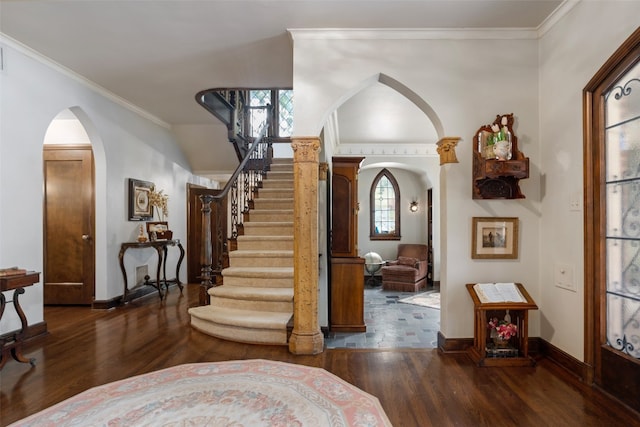 foyer entrance featuring dark hardwood / wood-style flooring and ornamental molding