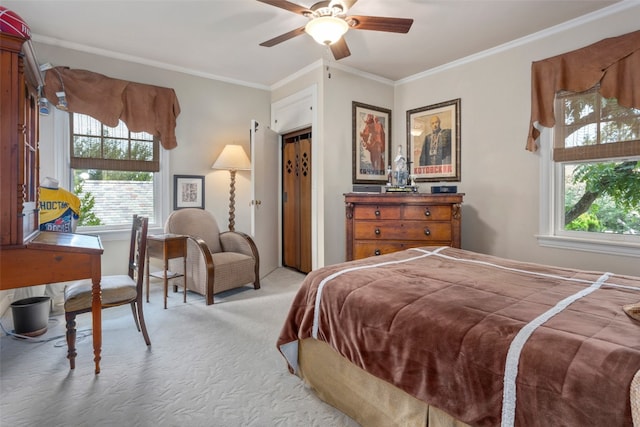 bedroom featuring light colored carpet, multiple windows, ceiling fan, and ornamental molding