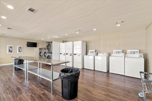 interior space featuring washer and clothes dryer, a textured ceiling, and dark hardwood / wood-style floors