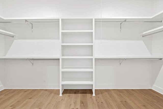 spacious closet featuring light wood-type flooring