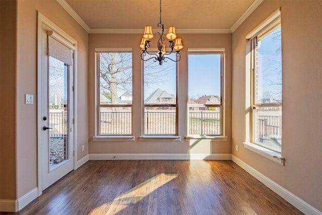 interior space with a notable chandelier, crown molding, and dark hardwood / wood-style flooring