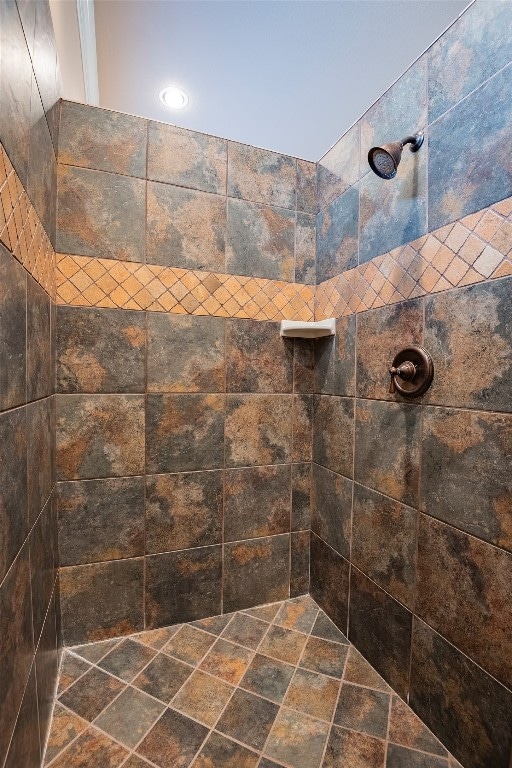 bathroom with tiled shower