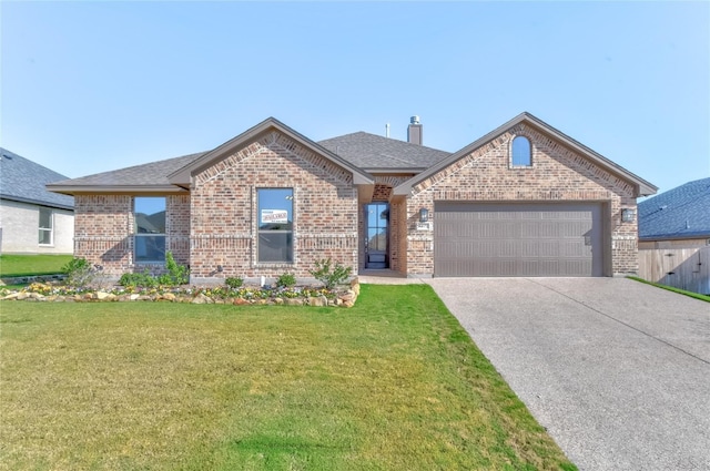 view of front facade with a front lawn and a garage