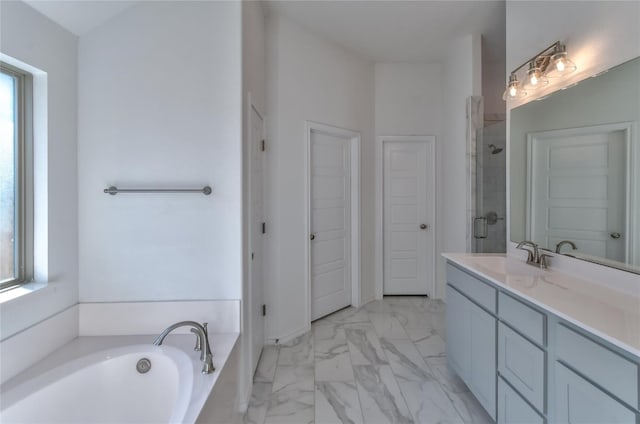 bathroom with plus walk in shower, tile floors, and vanity