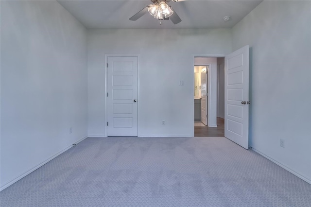 unfurnished room with light carpet and ceiling fan