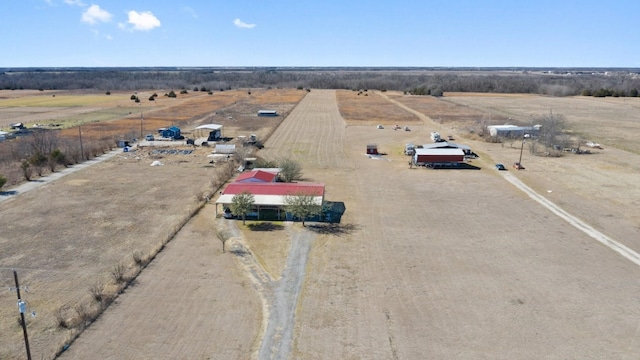 birds eye view of property featuring a rural view