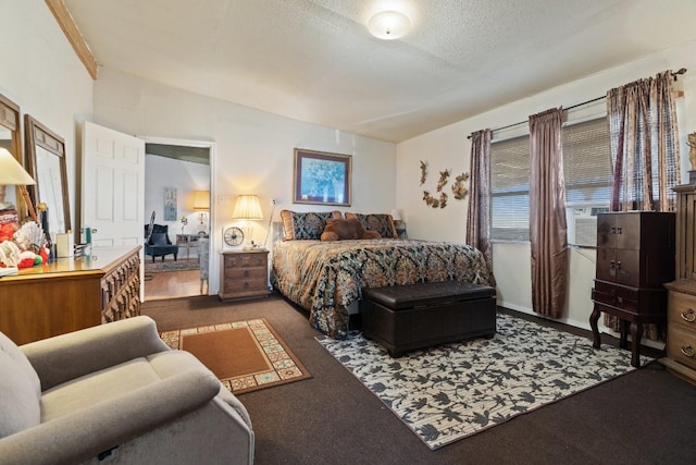 carpeted bedroom featuring a textured ceiling