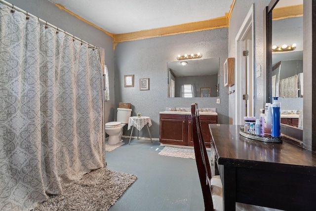 bathroom with toilet and vanity