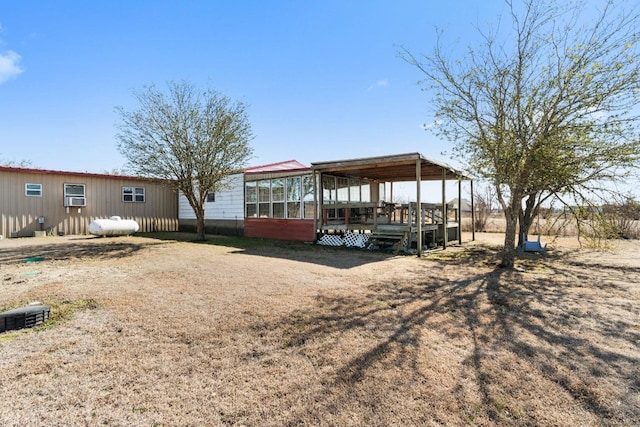 rear view of house with a wooden deck