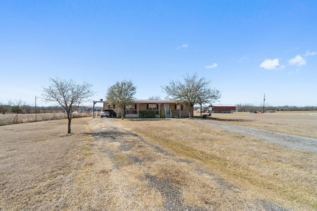 view of front of property with a rural view