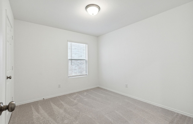 empty room with light colored carpet