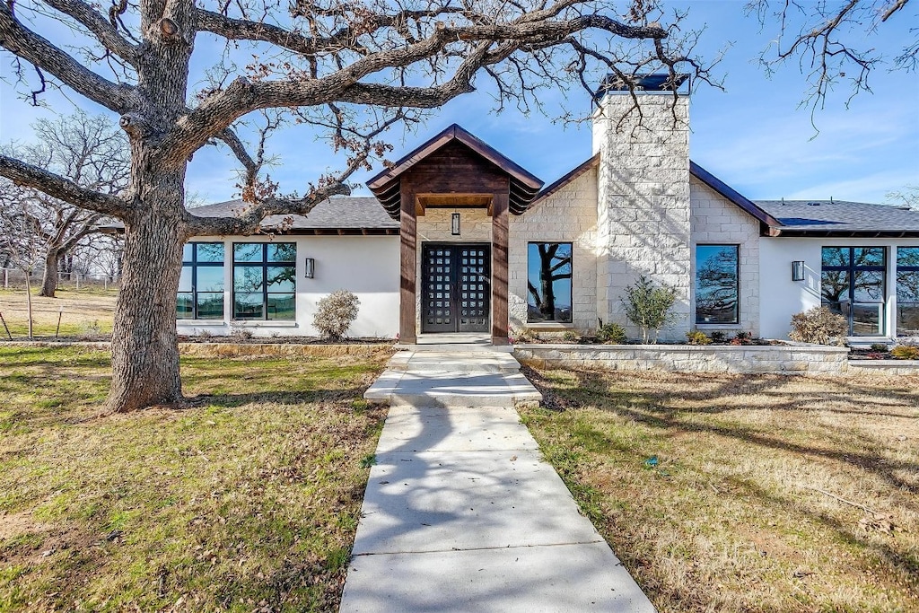 2245 SW Wilshire Blvd, Burleson, TX 76028 - view of front facade featuring a front lawn