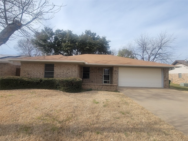 ranch-style house with a front yard and a garage