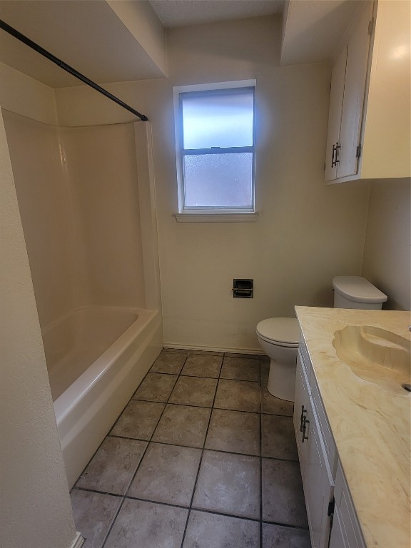 full bathroom with tile flooring, toilet, vanity, and shower / bath combination