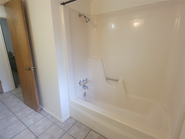 bathroom featuring tub / shower combination and tile flooring