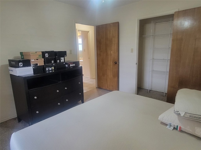 carpeted bedroom with a closet