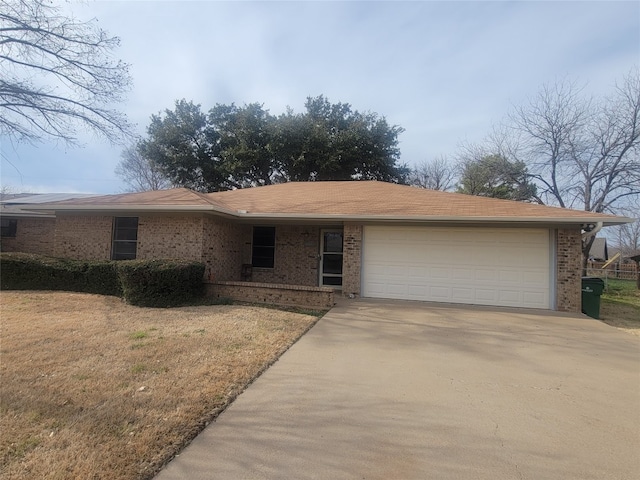 single story home featuring a garage