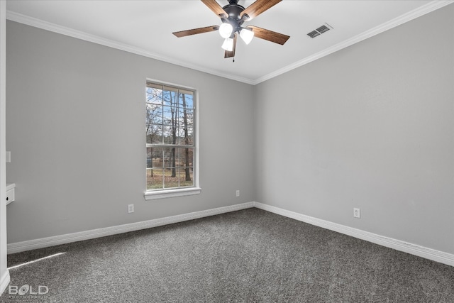 spare room featuring carpet, a healthy amount of sunlight, ornamental molding, and ceiling fan