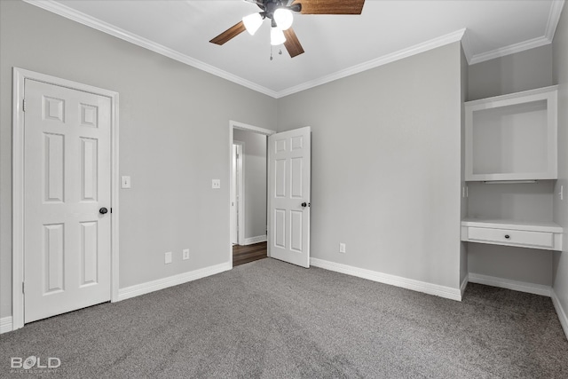 unfurnished bedroom featuring crown molding, ceiling fan, and dark colored carpet