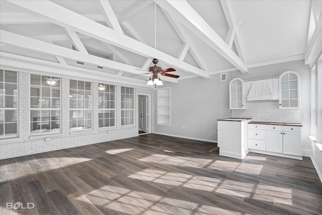 kitchen featuring ceiling fan, white cabinetry, dark wood-type flooring, and tasteful backsplash