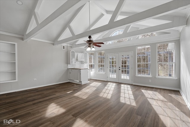 unfurnished sunroom featuring ceiling fan, lofted ceiling with beams, and french doors