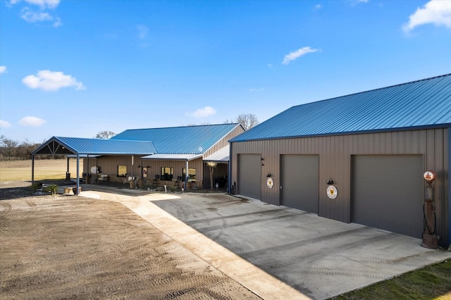 view of front facade featuring a garage and an outdoor structure