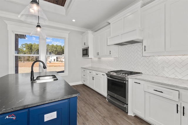 kitchen with decorative light fixtures, white cabinetry, dark hardwood / wood-style floors, stainless steel appliances, and sink