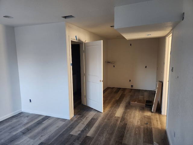 hall with dark hardwood / wood-style flooring